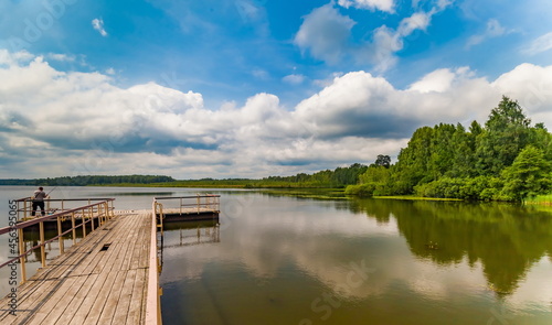 Wallpaper Mural River banks against blue sky with white clouds in summer Torontodigital.ca