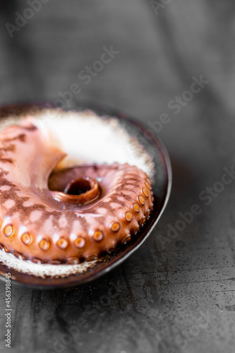 Delicious octopus tentacles served on plate. Seafood concept
