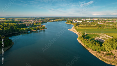 Aerial view of blue lakes and green forests on a sunny summer day in Poland. drone photography