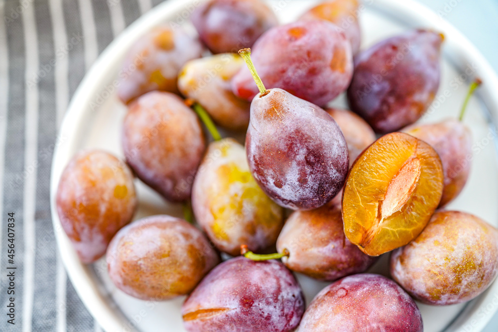 Indoor studio fresh prunes close-up Indoor studio fresh prunes close-up