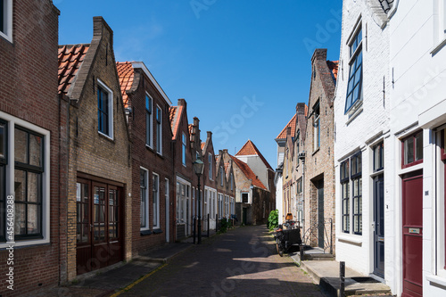 Walking in old Dutch town Zierikzee with old small houses and streets