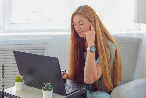 young businesswoman works at home at the computer. freelancer woman