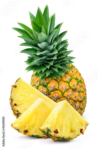 Pineapple with leaves and slices isolated. Whole and cut pineapple on white background. Full depth of field.