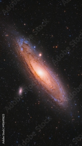 Andromeda Galaxy in space captured with a telescope with colorful stars 