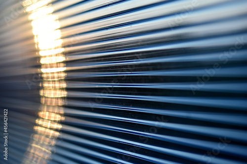Blue bright stripes of polycarbonate in the light photo