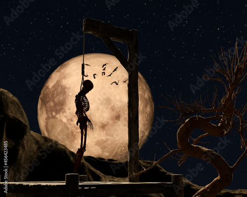 Fototapeta Gallow on a spooky night with a golden full moon and a hanged skeleton