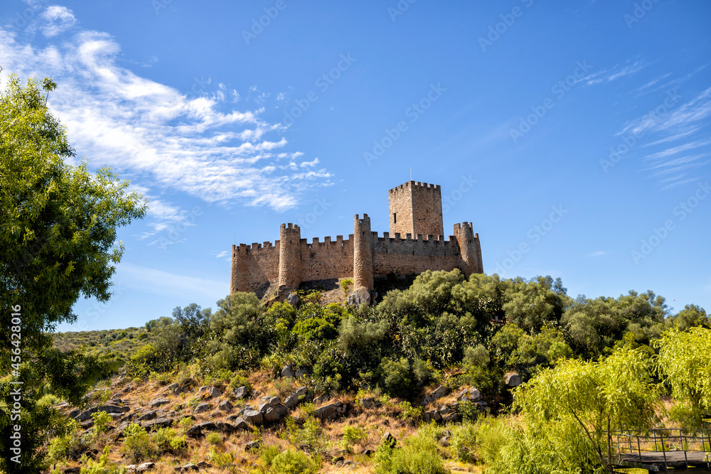 A view of the beautiful Almourol Castle located on a small island on the middle of the Tagus river, Portugal.