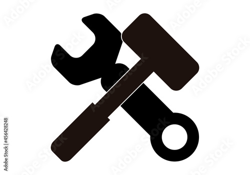 Icono negro de martillo y llave inglesa negra.
