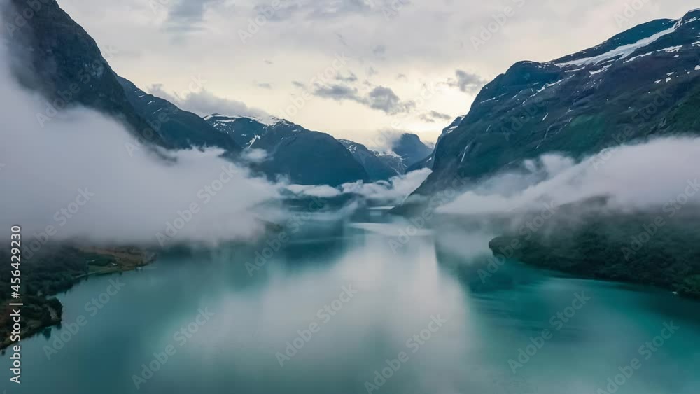 Beautiful Nature Norway natural landscape lovatnet lake flying over the clouds.