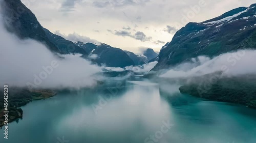 Beautiful Nature Norway natural landscape lovatnet lake flying over the clouds. photo
