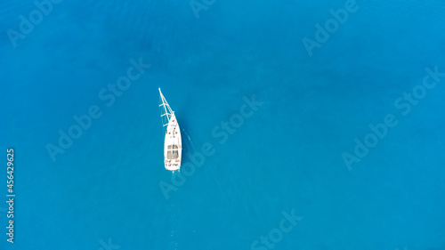 amazing view to yacht, swimming woman and clear water. © Angelov
