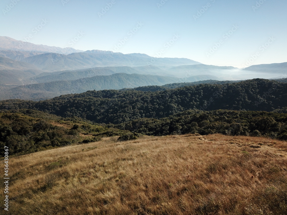 Villa Nougues area in the hills of Tucumán, town, meadow, wooded hills in autumn