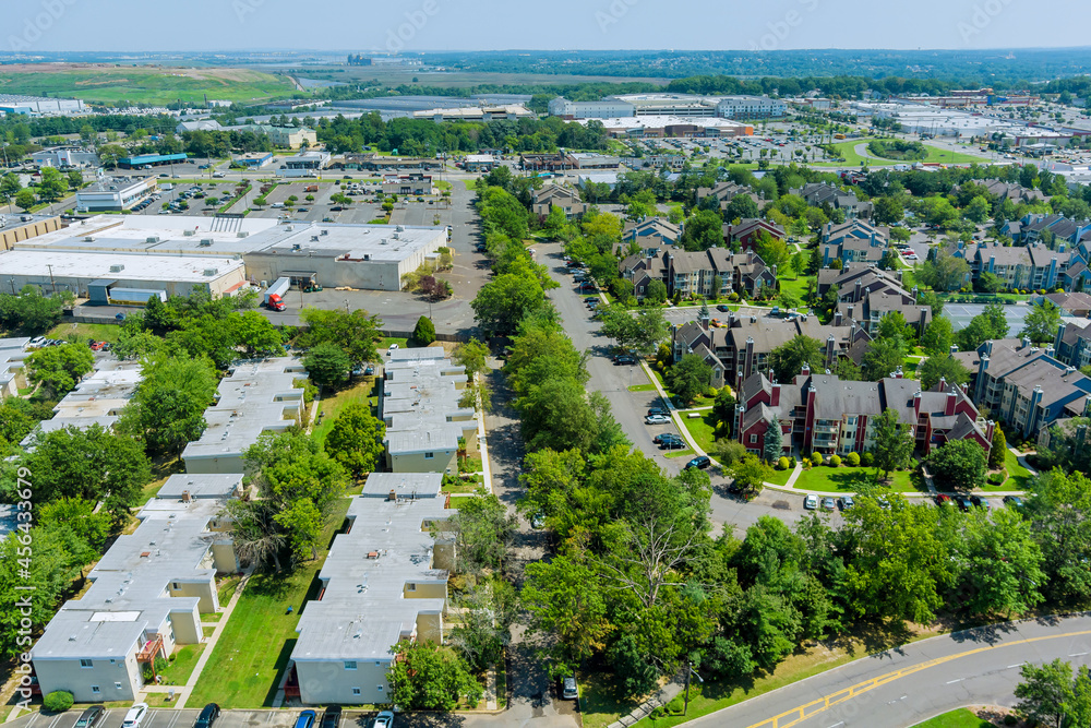 Aerial view of the residential area of beautiful suburb of home dwelling and road from a height.