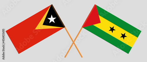 Crossed flags of East Timor and Sao Tome and Principe. Official colors. Correct proportion