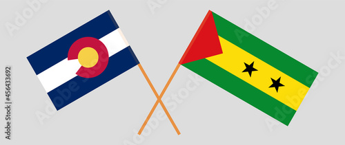 Crossed flags of The State of Colorado and Sao Tome and Principe. Official colors. Correct proportion