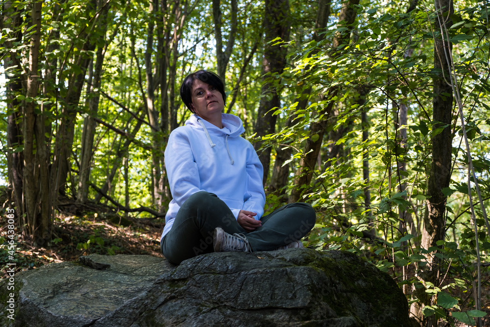 Rest in the nature with young woman in a forest Rest in the nature with young woman in a forest