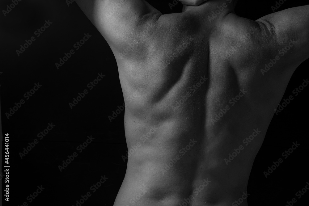 Unrecognizable man rear view, back pain and spine issues Unrecognizable man rear view, back pain and spine issues