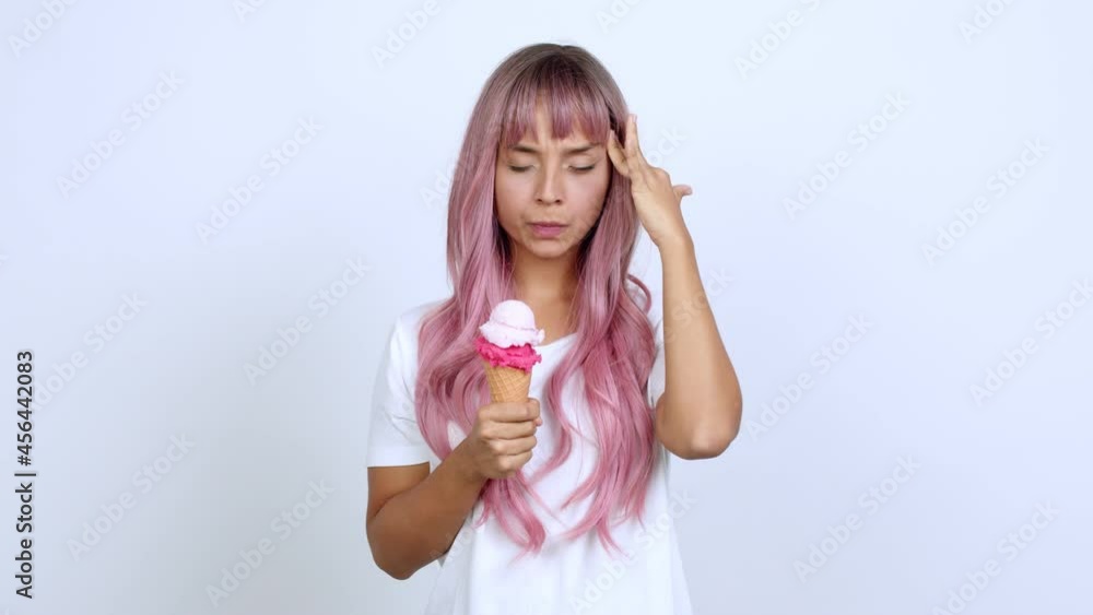 holding a cornet ice cream unhappy and frustrated with something over isolated background holding a cornet ice cream unhappy and frustrated with something over isolated background