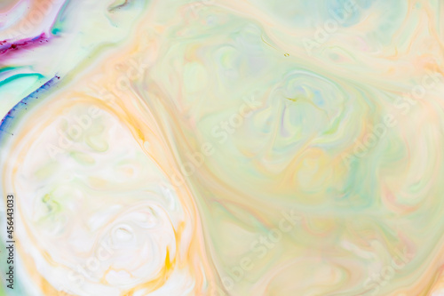 Multicolored lines and spots on liquid surface. Abstract background made with fluid art technique. Trendy colorful backdrop. Fluid art © Lazartivan