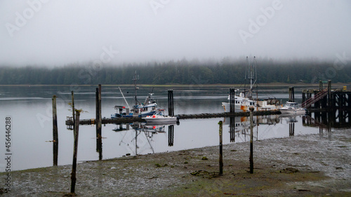 Looking out to the government wharf in Winter Harbour, British-Columbia. An old wooden boardwalk follows the shoreline