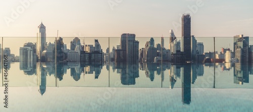 Photography Cityscape and high-rise buildings in metropolis city with water reflection in the early morning