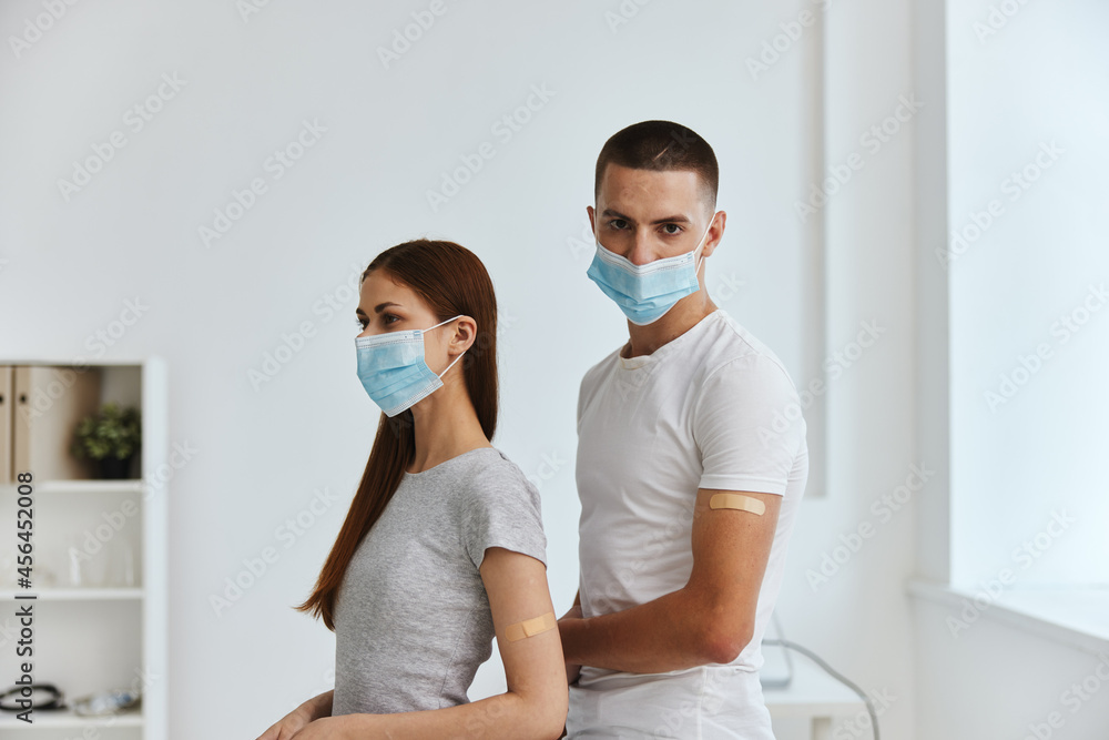 man and woman holding a perforator vaccine passport health hospital man and woman holding a perforator vaccine passport health hospital