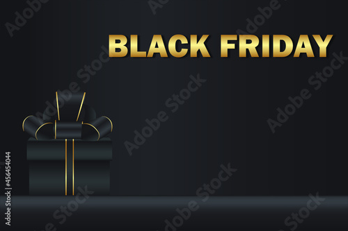 Nice black friday concept focused on gift with bow and golden lettering on dark background.