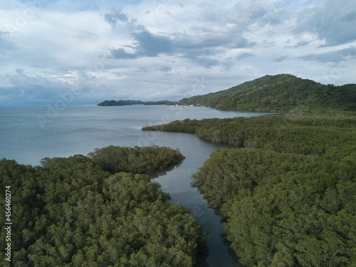 Brackish water estuaries and inlets dot the shoreline of Paquera Costa Rica as they are fed from the clear rich waters of the Gulf of Nicoya from an aerial drone view photo