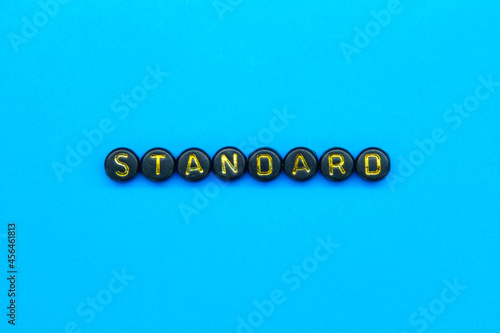 lowercase letters in black circles with standard words