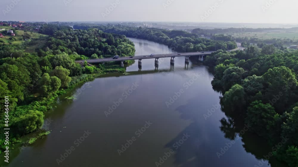 Traffic on the bridge that crosses the river Traffic on the bridge that crosses the river