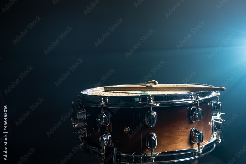 Obraz premium Snare drum on a black background, musical instrument, musical concept.