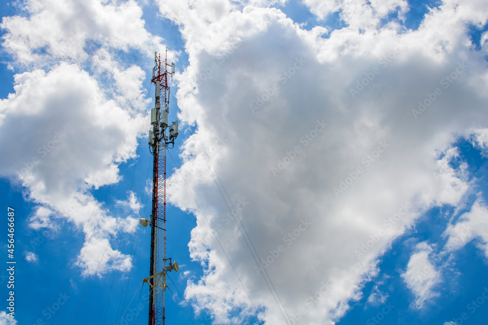Telecom, Single Telecom mast or Telecommunication mast TV antennas wireless technology with cloudy blue sky background, Show tower infrastructure. Telecom, Single Telecom mast or Telecommunication mast TV antennas wireless technology with cloudy blue sky background, Show tower infrastructure.