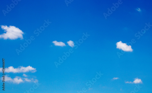 Blue sky with small fluffy clouds  summer time. for background