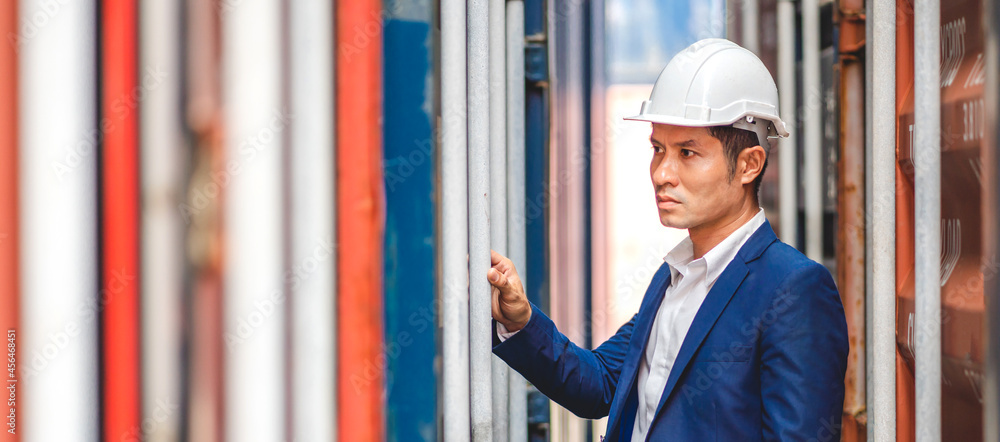 Professional engineer container cargo foreman in helmets working standing checking stock into container for loading.logistic transport and business industry export Professional engineer container cargo foreman in helmets working standing checking stock into container for loading.logistic transport and business industry export