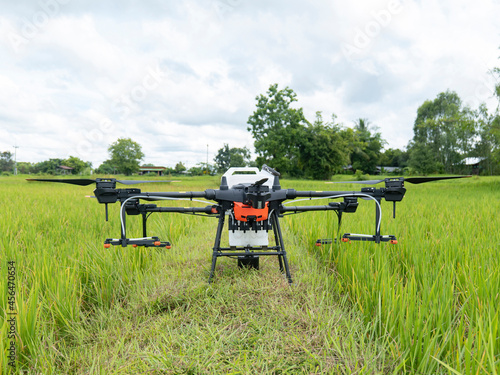 Agricultural drones prepare to fly by spraying fertilizers through the leaves. Agricultural technology smart farm concept.
