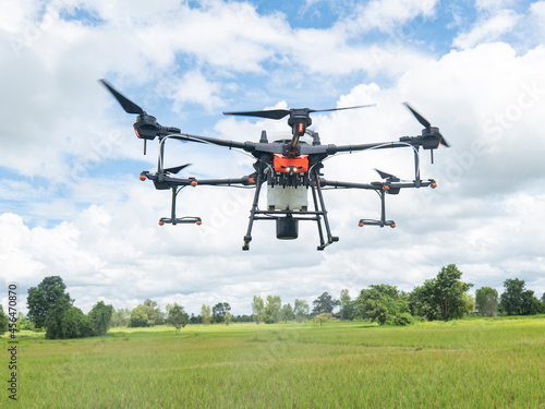 Agricultural drones make flights to prepare to spray rice fields. Agricultural technology smart farm concept.