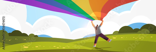 woman holding lgbt rainbow flag gay lesbian love parade pride festival transgender love concept