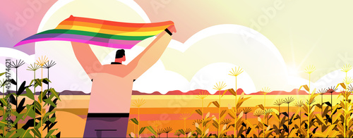 man holding lgbt rainbow flag gay lesbian love parade pride festival transgender love concept