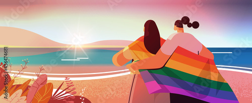 two girls holding lgbt rainbow flag gay lesbian love parade pride festival transgender love concept