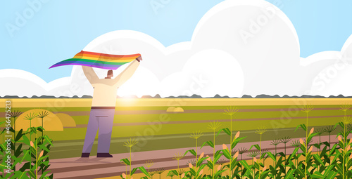man holding lgbt rainbow flag gay lesbian love parade pride festival transgender love concept