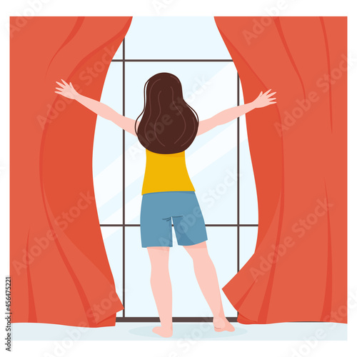 The woman woke up and opened the window in the room.