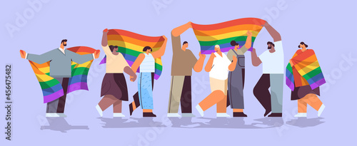 mix race people group holding lgbt rainbow flag gay lesbian love parade pride festival transgender love concept