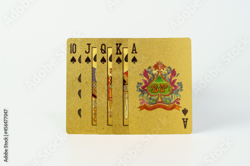 Golden playing cards isolate on white background. Close up of  playing cards set.
