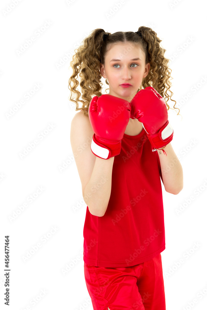 Teen blonde girl fighting in red boxing gloves Teen blonde girl fighting in red boxing gloves