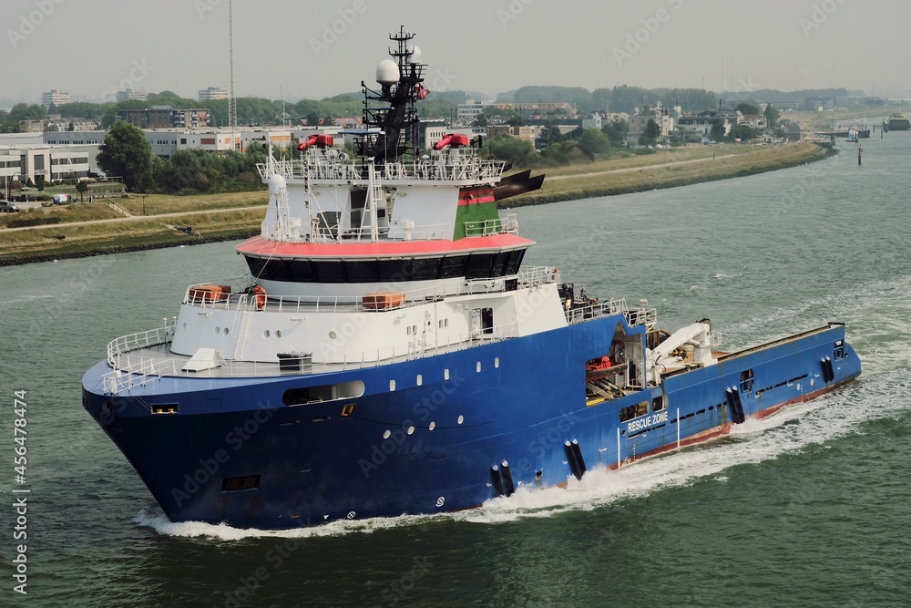 Offshore support vessel underway on Maas river