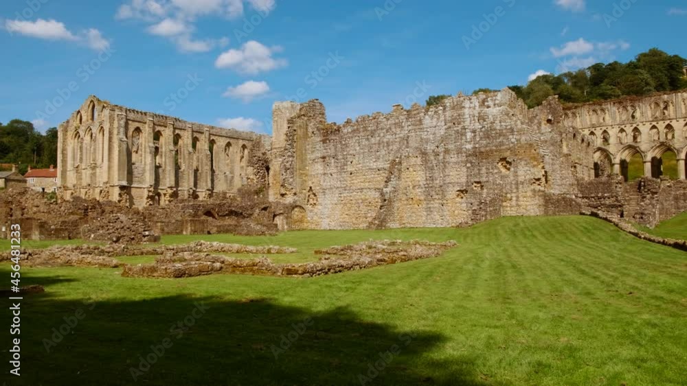 Cinematic view of the stunning Rievaulx Abbey in the North York Moors National Park, North Yorkshire, England, UK, dating back to 1132 Cinematic view of the stunning Rievaulx Abbey in the North York Moors National Park, North Yorkshire, England, UK, dating back to 1132