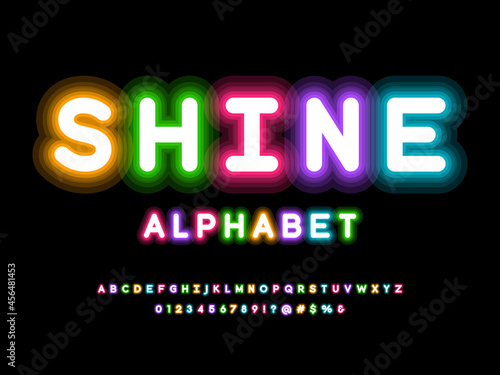 Glowing neon light alphabet design with uppercase, numbers and symbol