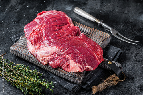 Fototapete Uncooked Raw Flank or flap beef steak on butcher board