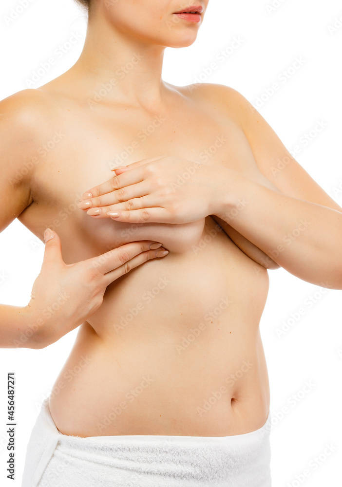 Woman examining breast isolated on white background
Woman examining breast isolated on white background