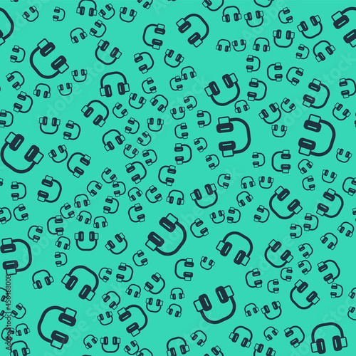 Black Headphones icon isolated seamless pattern on green background. Earphones. Concept for listening to music  service  communication and operator. Vector